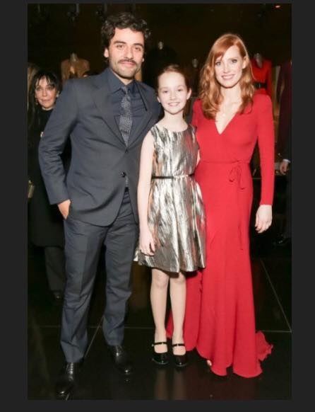 Taylor pictured with Oscar Isaac and Jessica Chastain at the NYC premiere of their film A Most Violent Year.