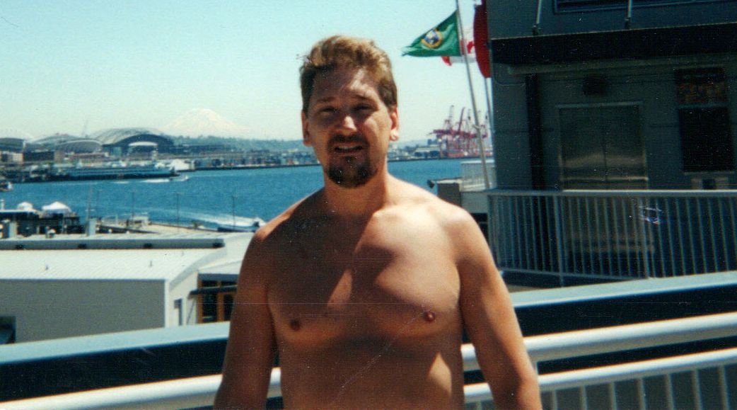 Shirtless in Seattle with Mount Rainier in background