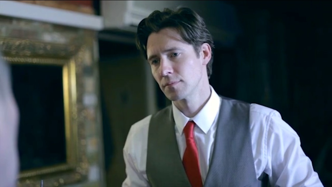 Still from 'the universe game' playing restaurant manager Mike