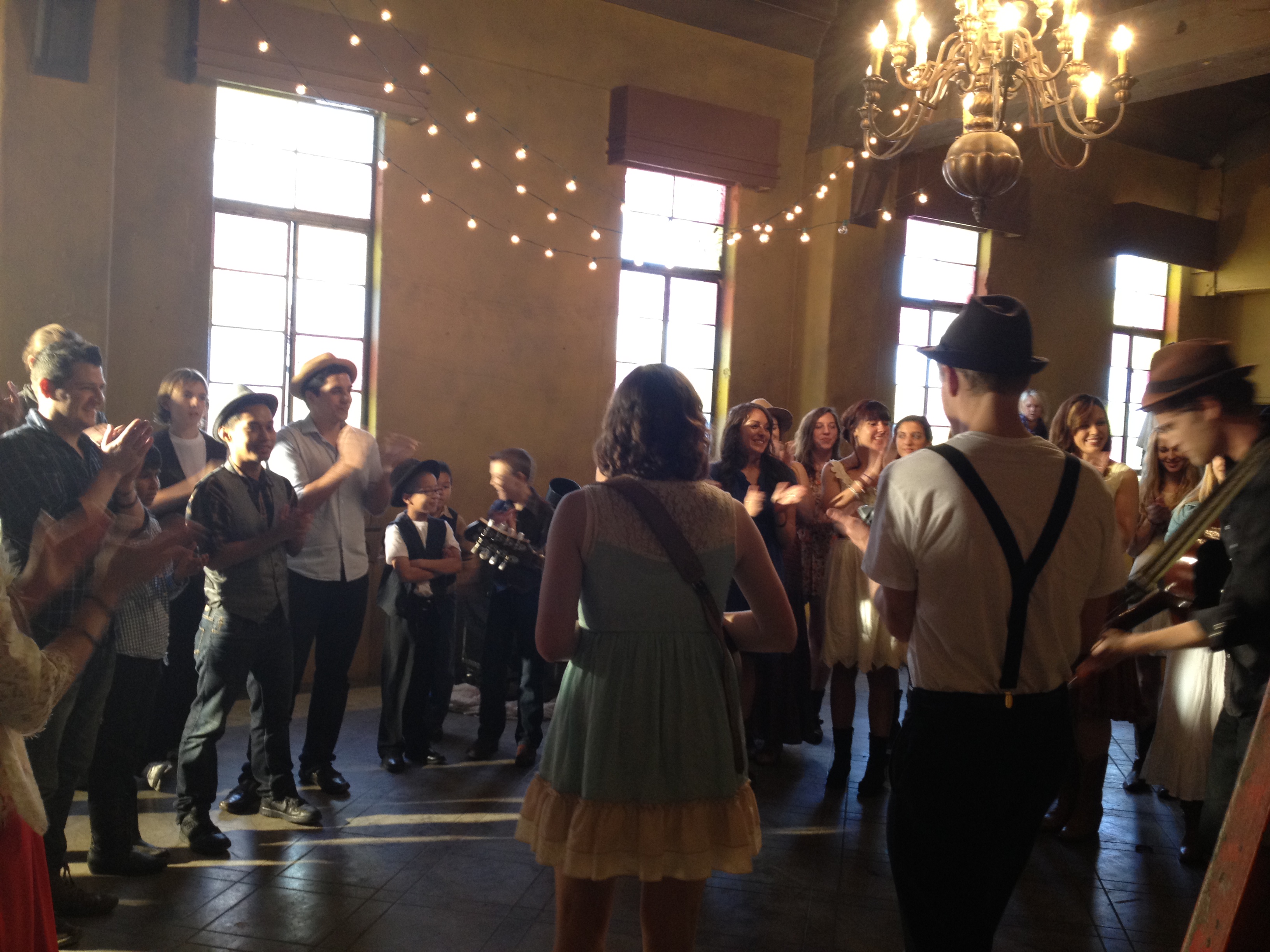 On set of the music video Ho Hey by the Lumineers, Adam is on the left.