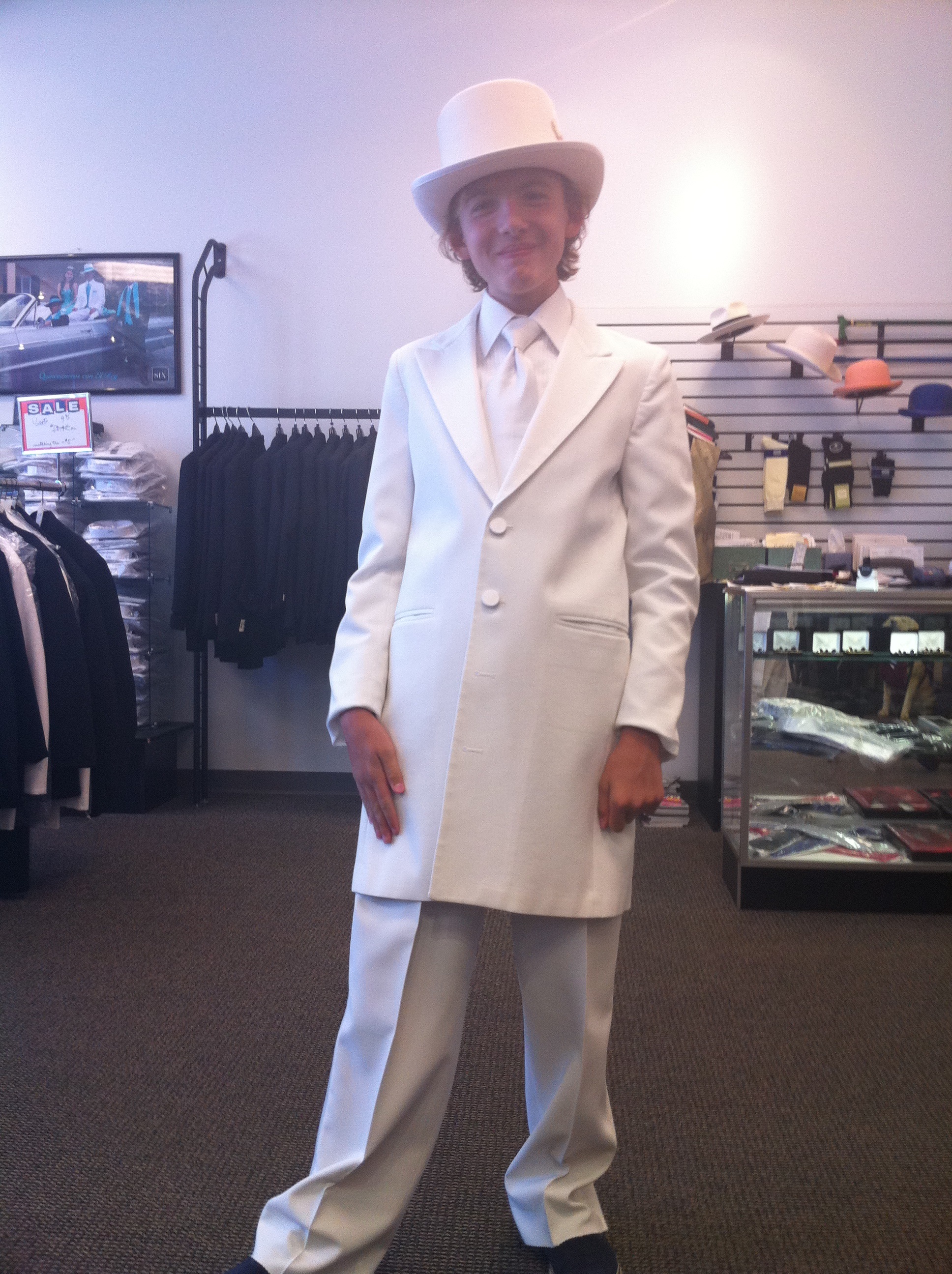 Adam trying on costume for Fred Astaire number, Top Hat and Tails.