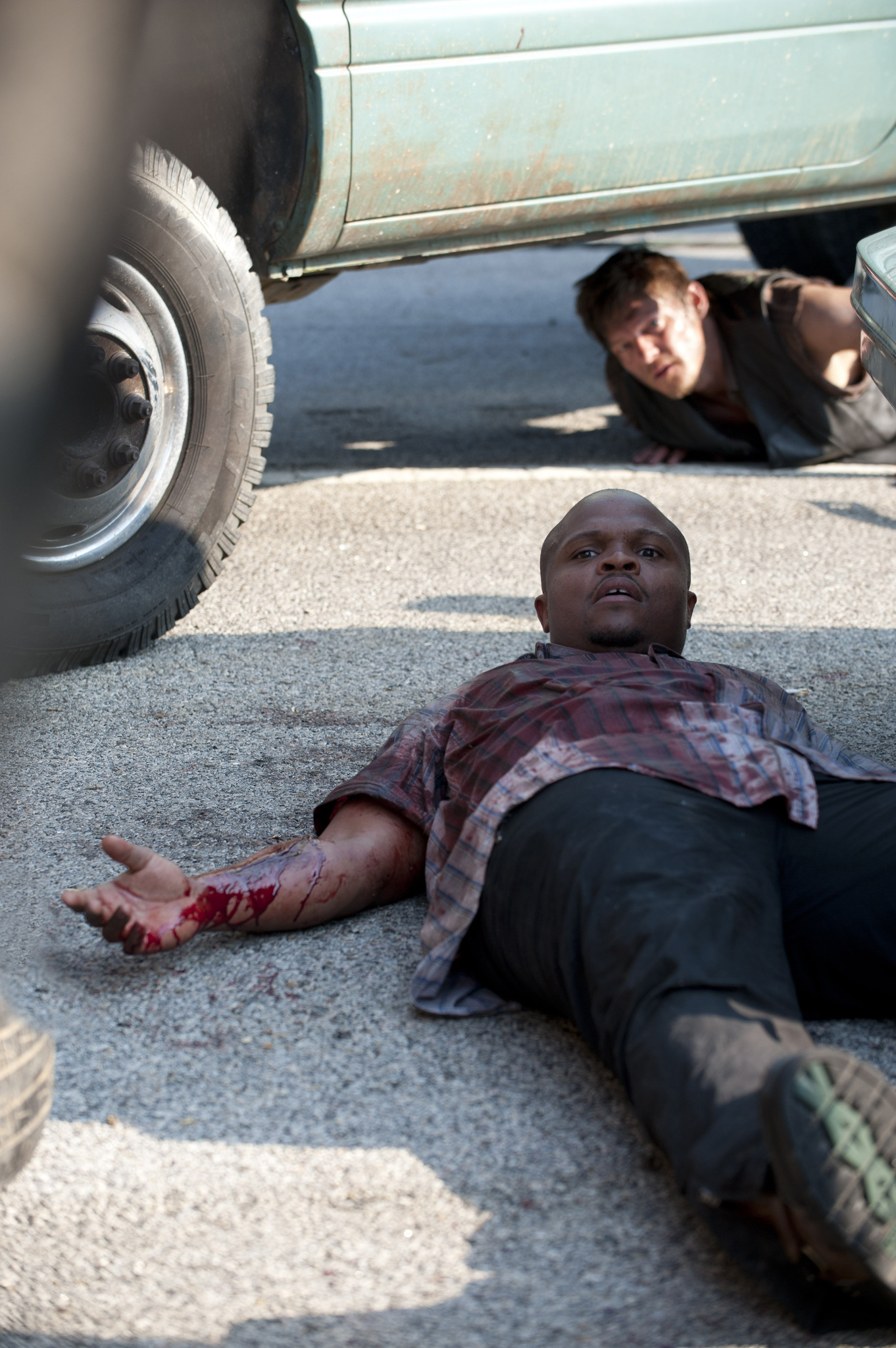 Still of Norman Reedus and Irone Singleton in Vaikstantys numireliai (2010)