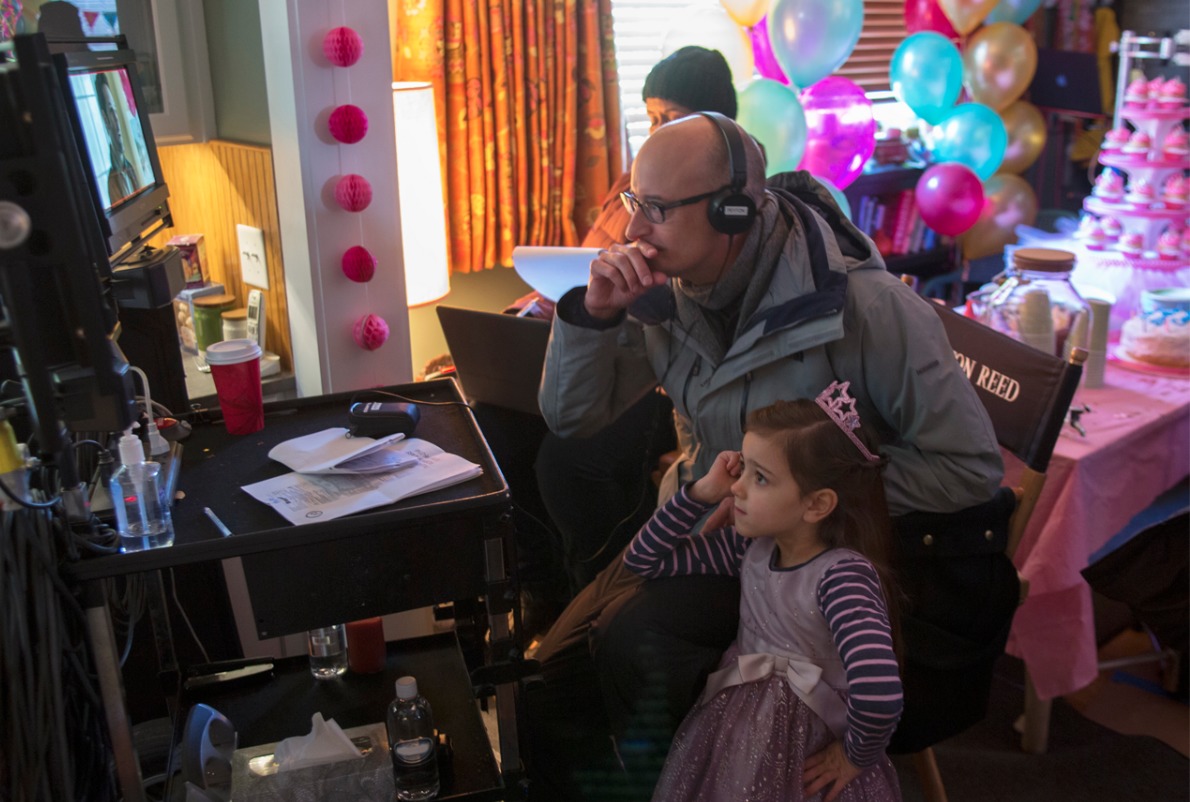 Abby Ryder Fortson starring as Cassie Lang, Paul Rudd's Daughter, in Marvel's Ant-Man. Here watching playback with director Peyton Reed.