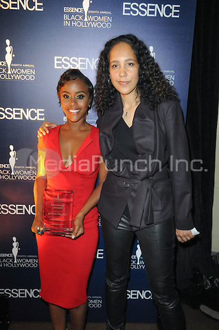 Iman N. Milner poses with director Gina Prince Bythewood at the Essence Magazine Black Women In Hollywood luncheon in Beverly Hills, CA.