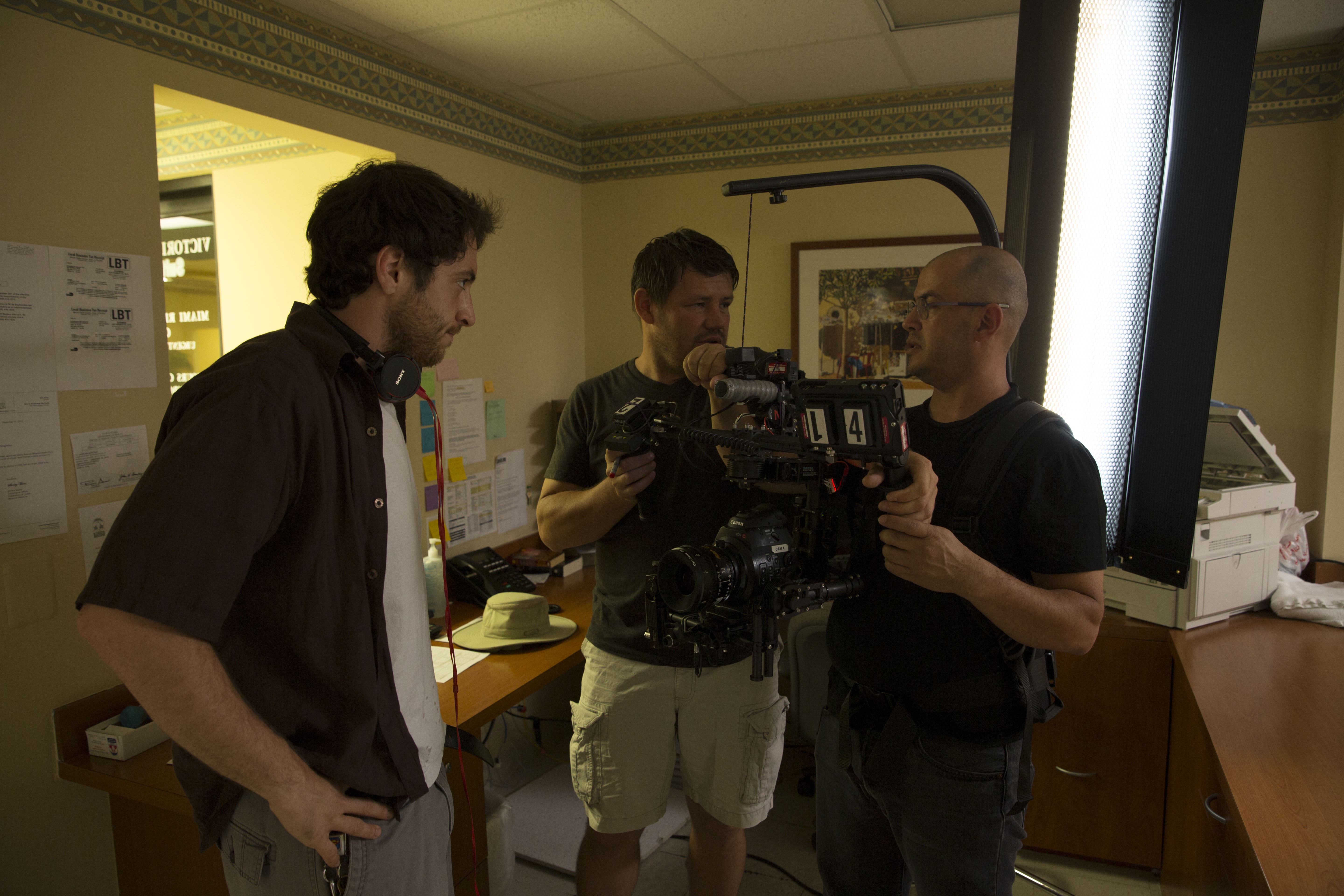 Ryan Anthony having a discussion on-set about the set up of a shot.