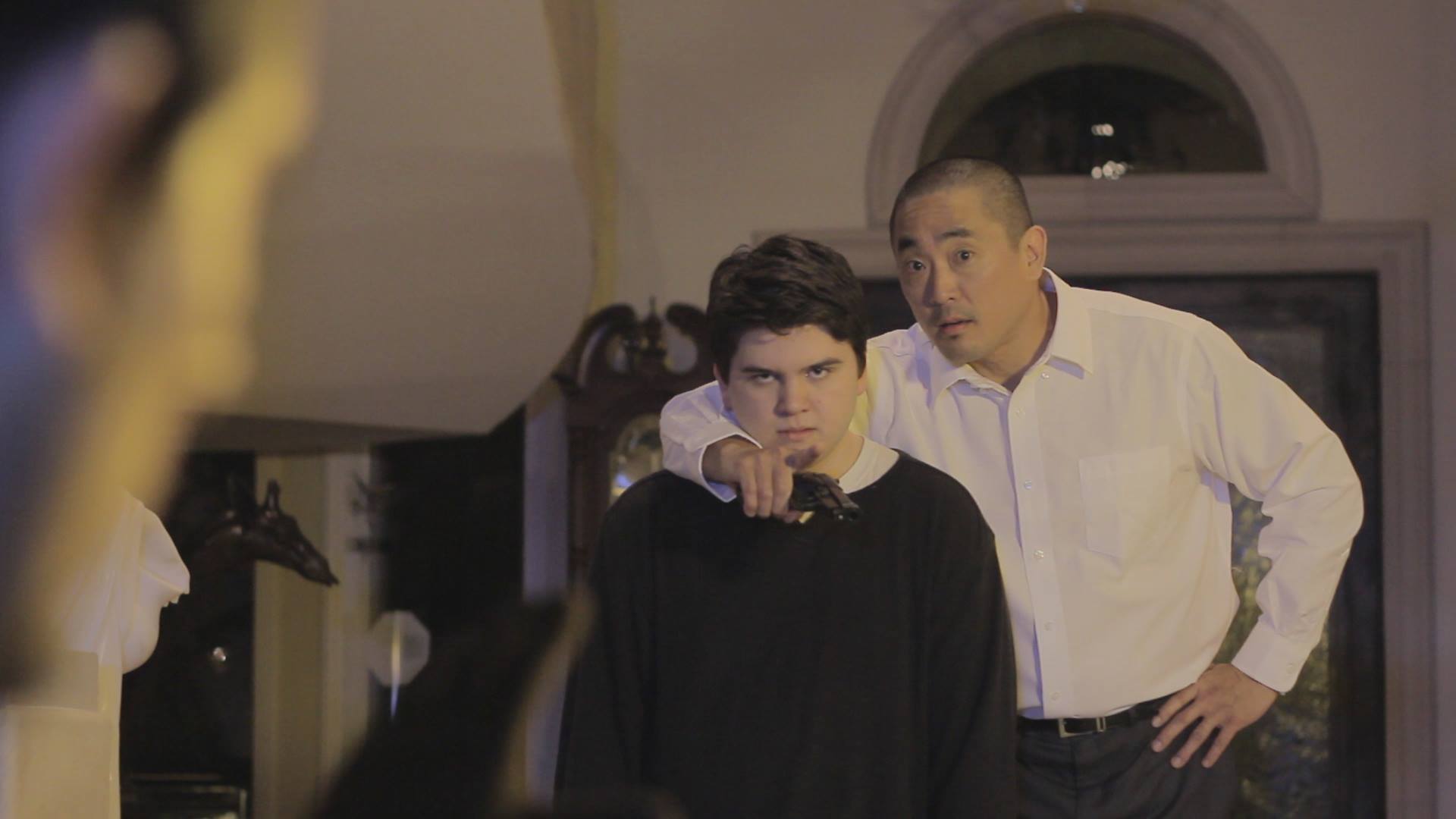 Still of Sean Patrick Flaherty and Garret Sato in To Topple an Empire.