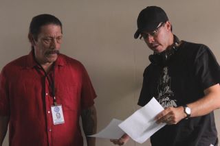 Discussing the scene with Danny Trejo on the set of Counterpunch.