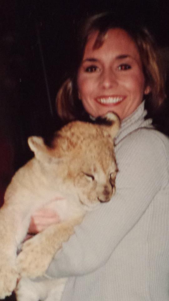 Heather holding one of Jack Hannah's lion cubs