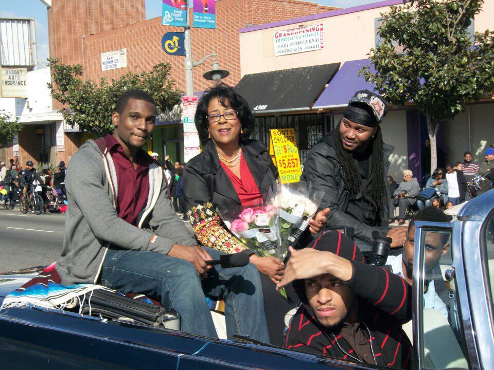 Jared Davis riding in Martin Luther King Day Parade with Council Woman Jan Perry