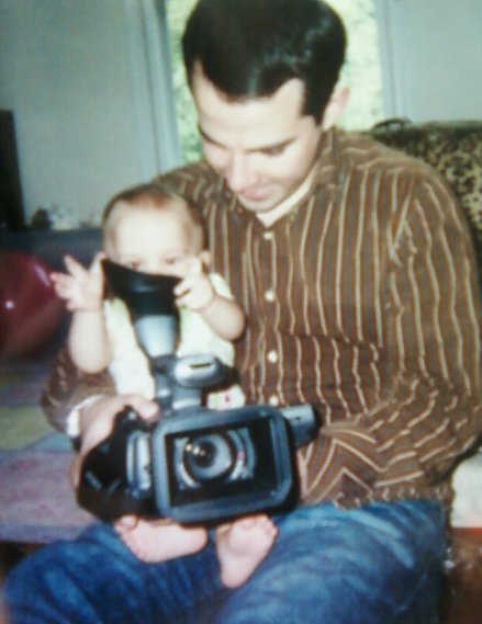 Jeremiah Bennett and his daughter Abigail Bennett with her first encounter with a video camera.