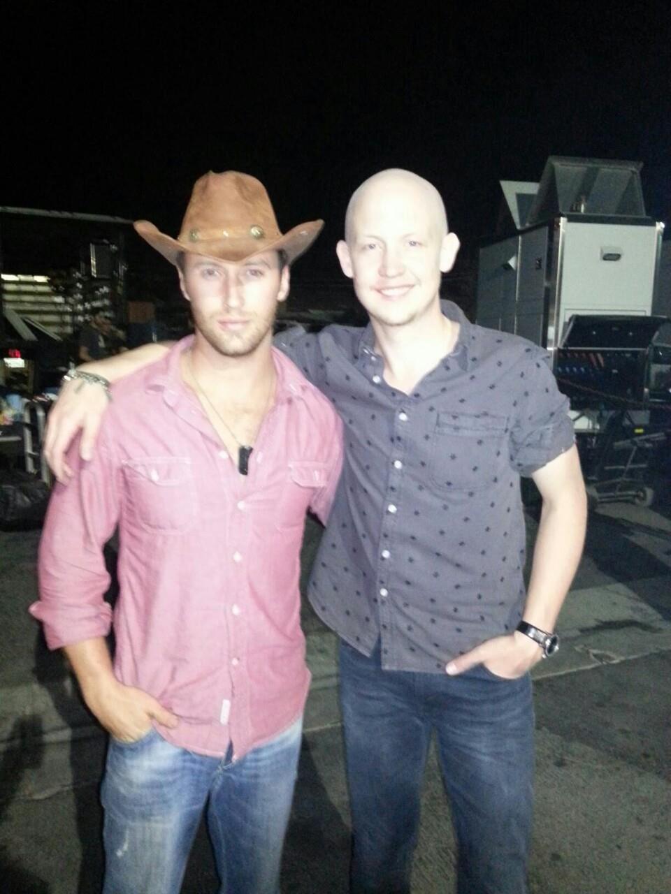 on set with lead singer of the Fray.