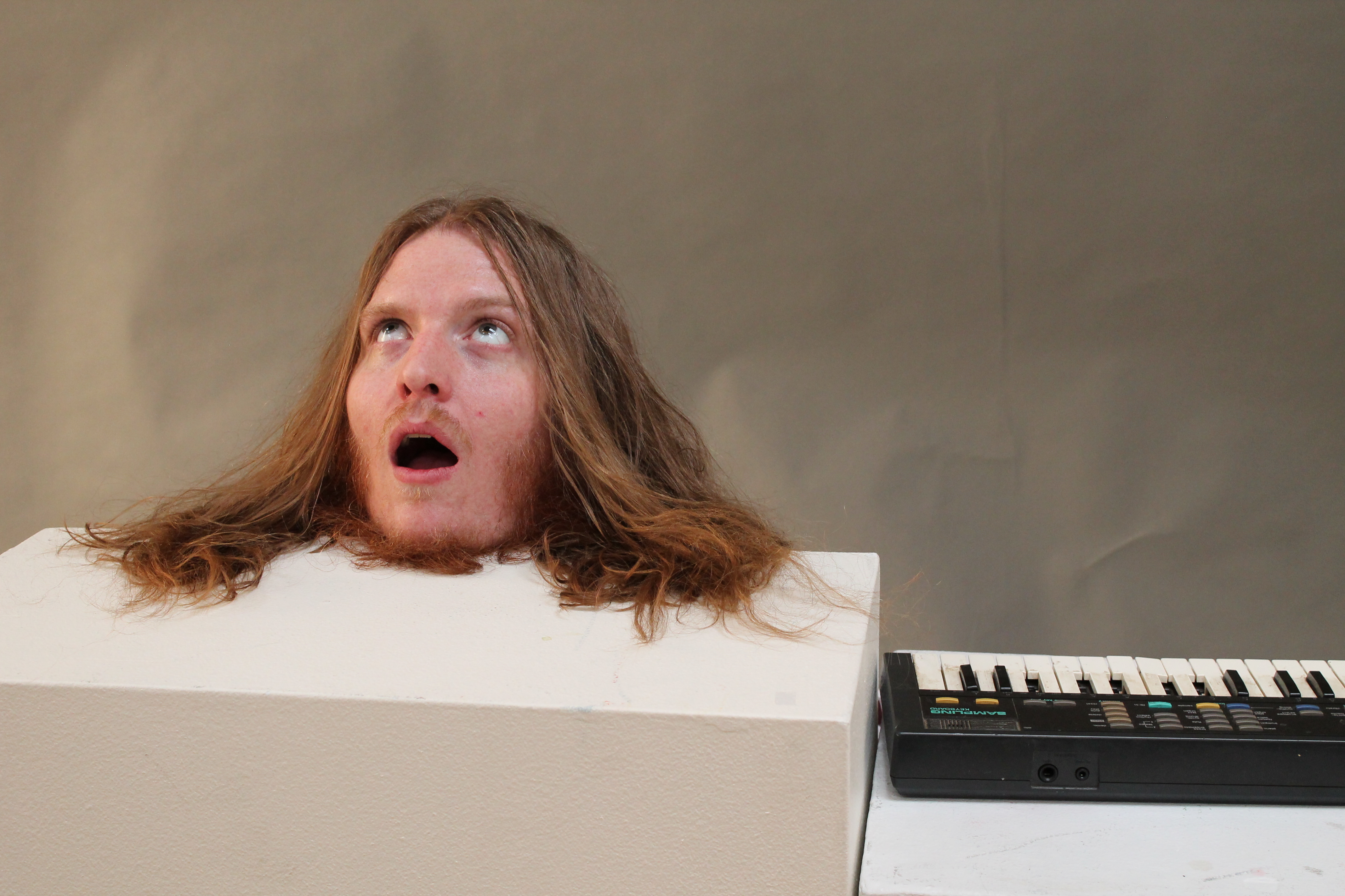 Fun with broken keyboards and heads on pedestals.