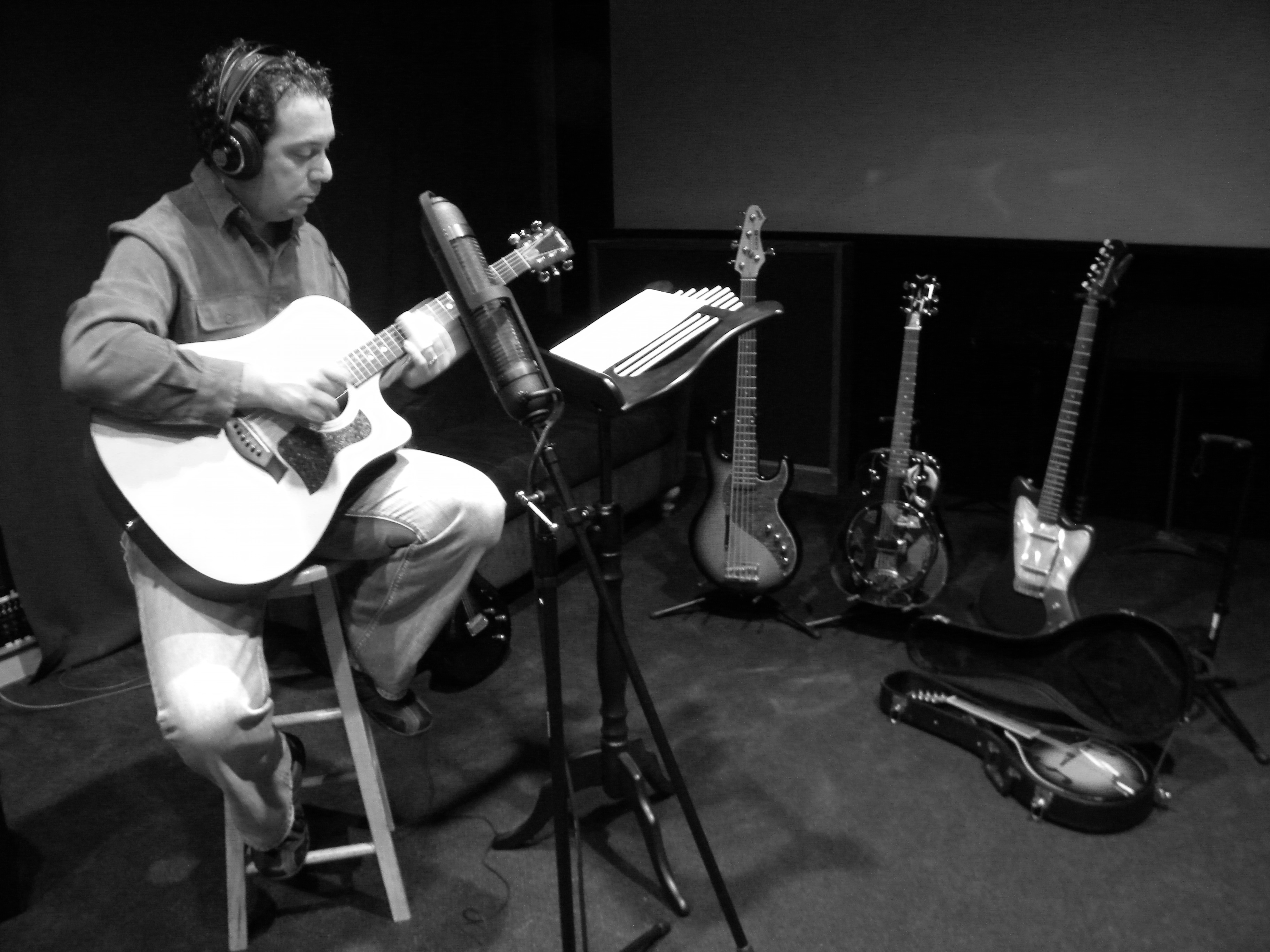 Composer Ben Zarai recording guitar