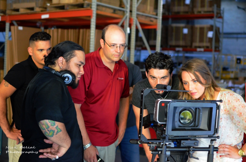 Gathering for playback on the set of The Red Suit.