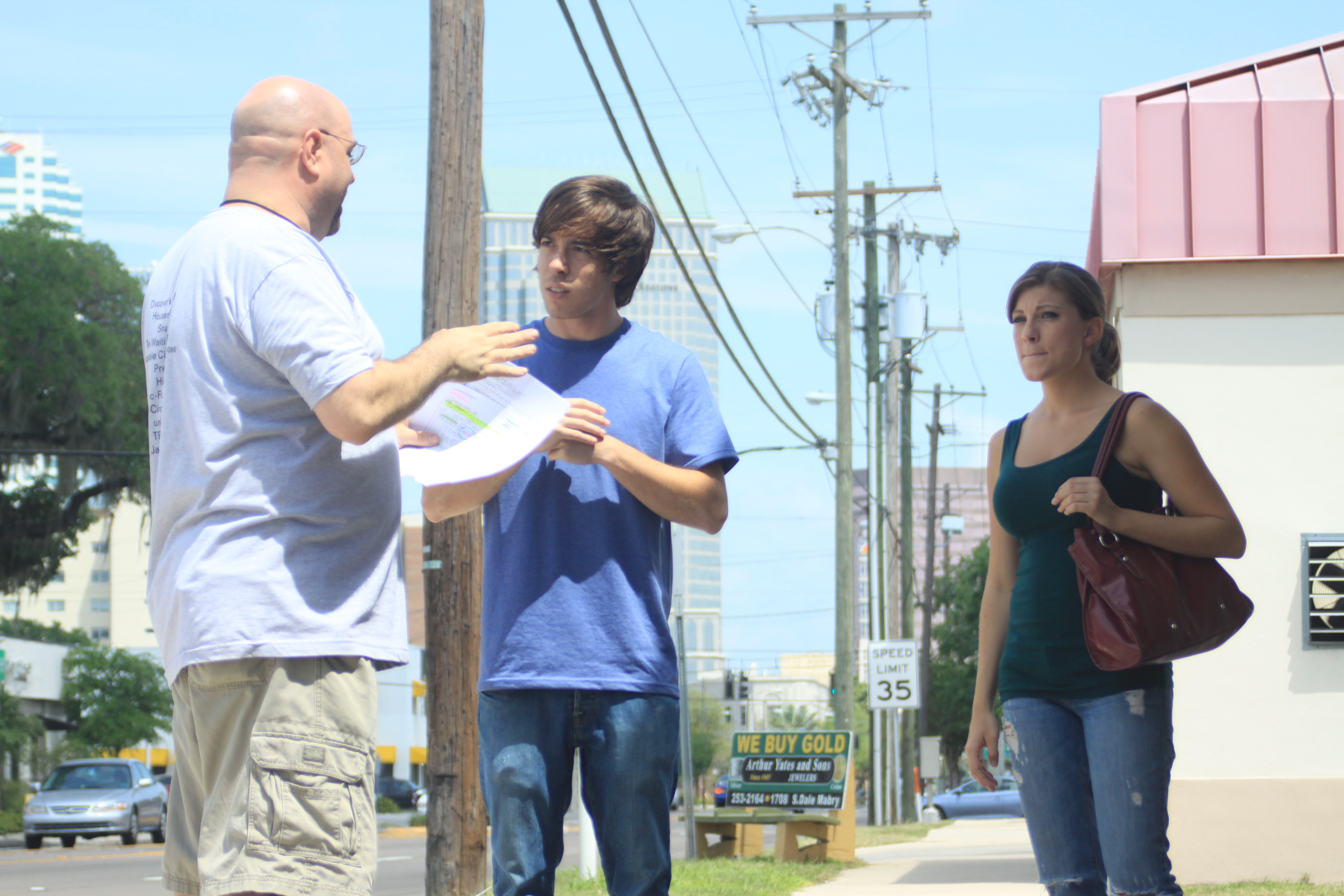 Director Donald E. Reynolds talking with Justifiable Circumstances' leads Michael Rodriguez and Natalie Stavola.