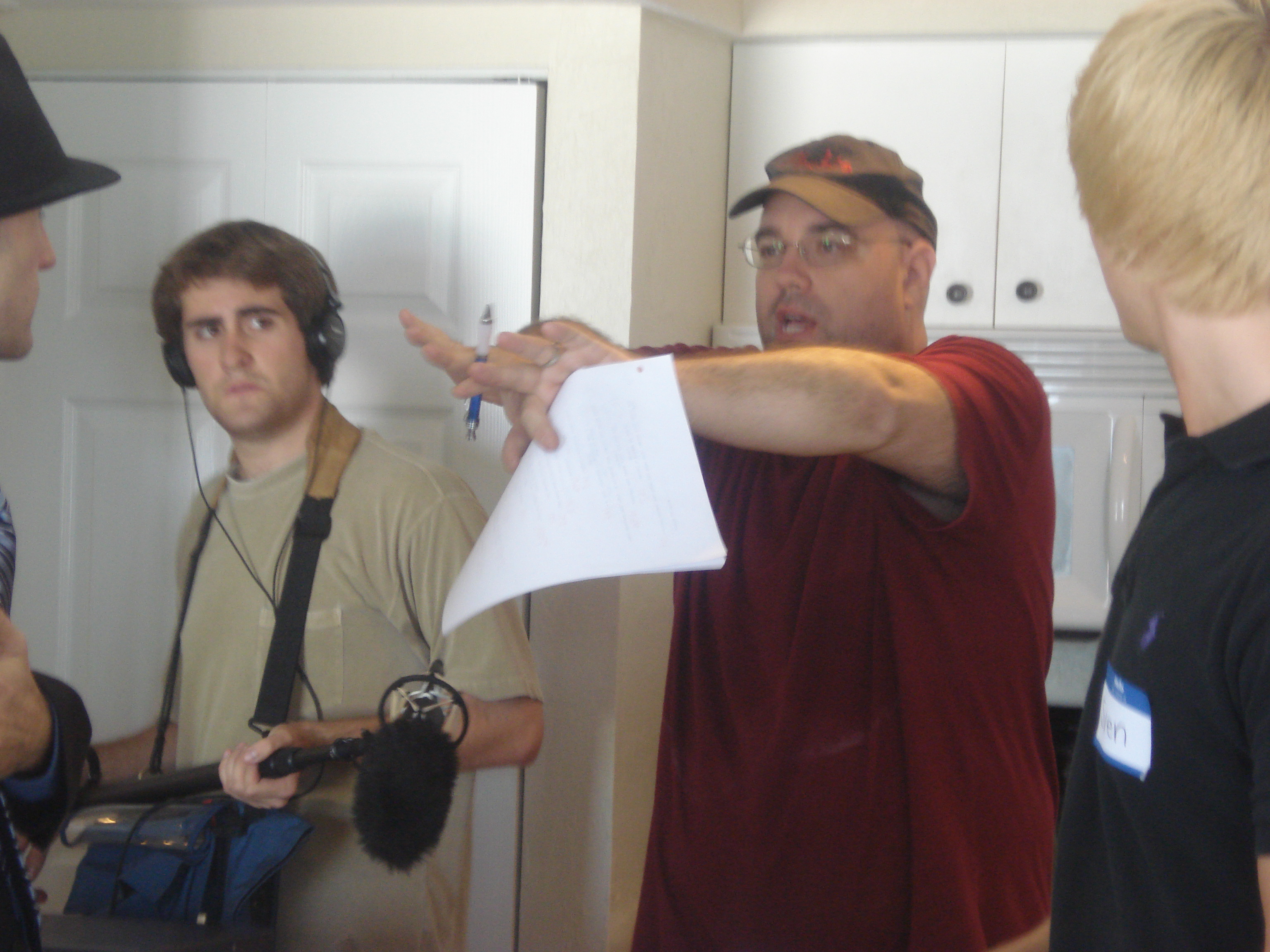 Director Donald E. Reynolds on the set of The Circle of Men, with Boom Operator Eavan Sullivan and actors.