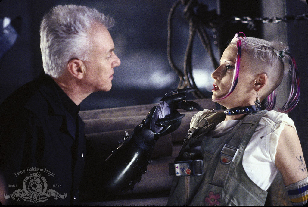 Still of Malcolm McDowell and Lori Petty in Tank Girl (1995)