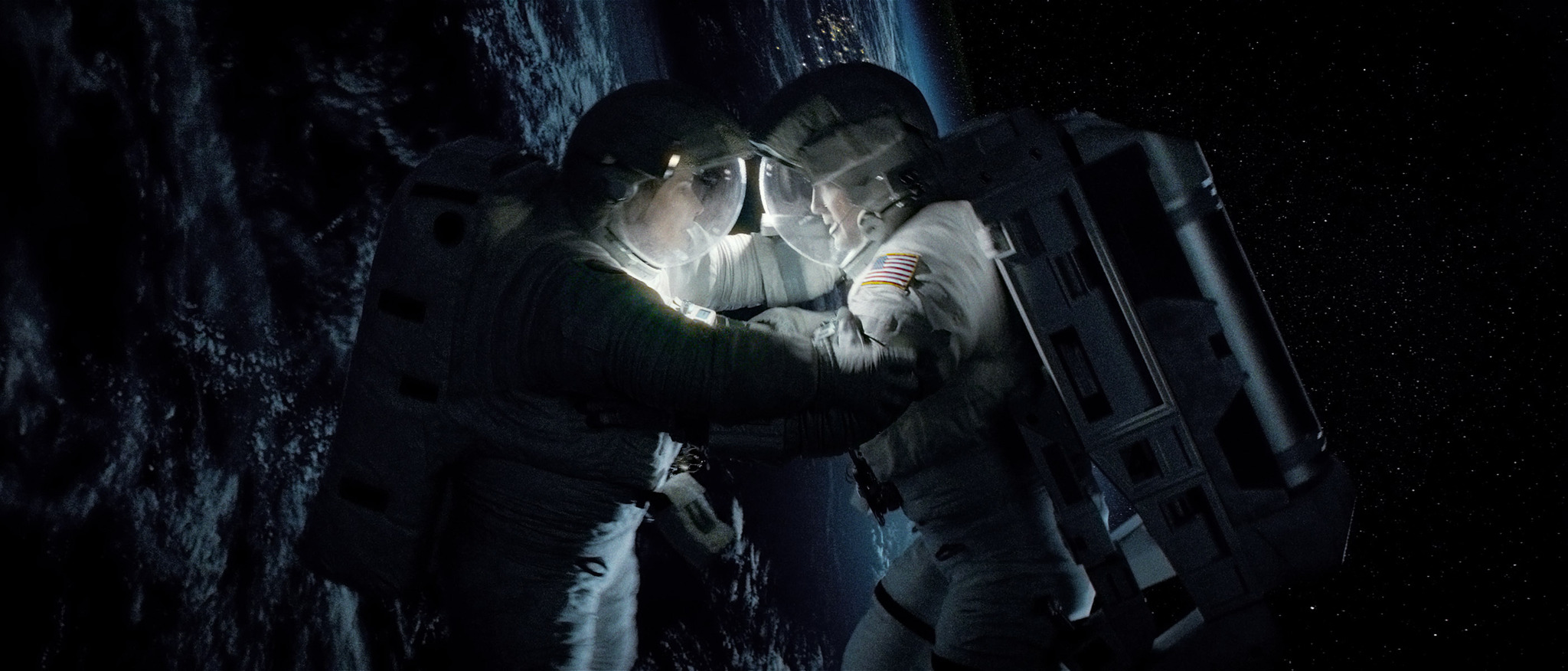 Still of Sandra Bullock and George Clooney in Gravitacija (2013)