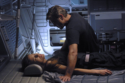 Chris Kelvin (George Clooney) ponders the shocking appearance of his beloved wife Rheya (Natascha McElhone) aboard a space station.