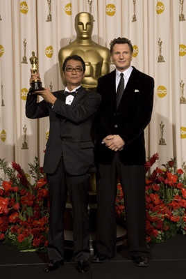 Academy Award®-winner Yojiro Takita (left) with presenter Liam Neeson backstage at the 81st Academy Awards® are presented live on the ABC Television network from The Kodak Theatre in Hollywood, CA, Sunday, February 22, 2009.