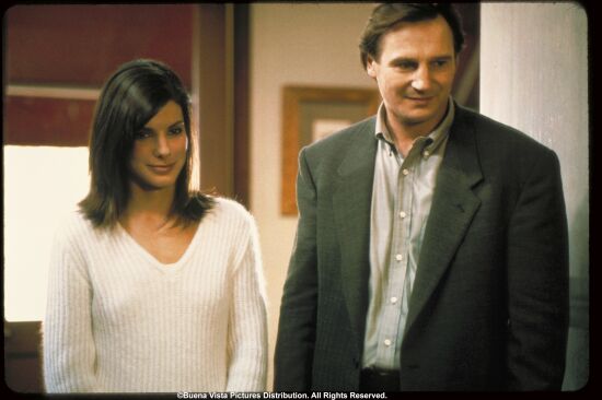 Sandra Bullock (playing Judy) stars opposite Liam Neeson (playing Charlie)