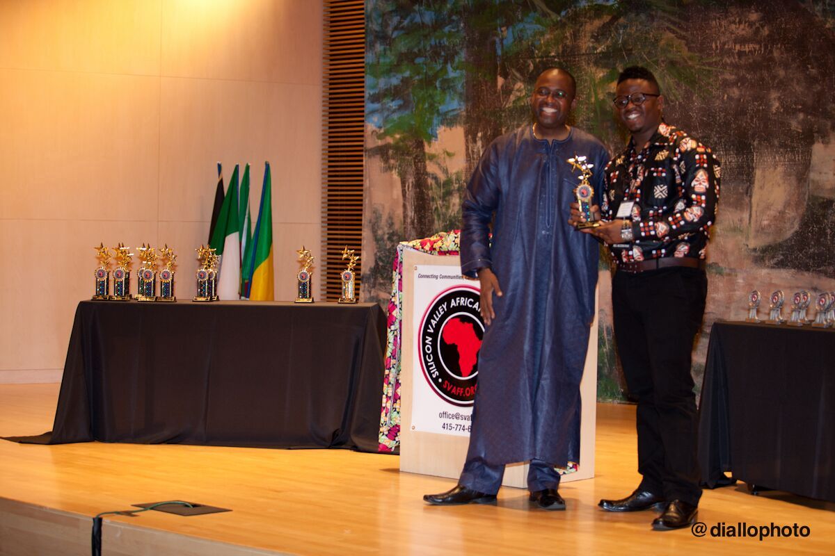 Timoth Conrad receiving a trophy for his film Dogo Masai (2014) at Silicon Valley African Film Festival 2014