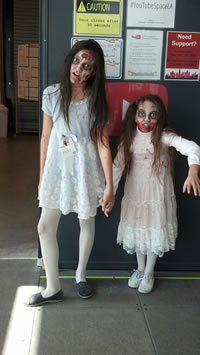 Emily on set of a zombie movie with her sister Gracie.