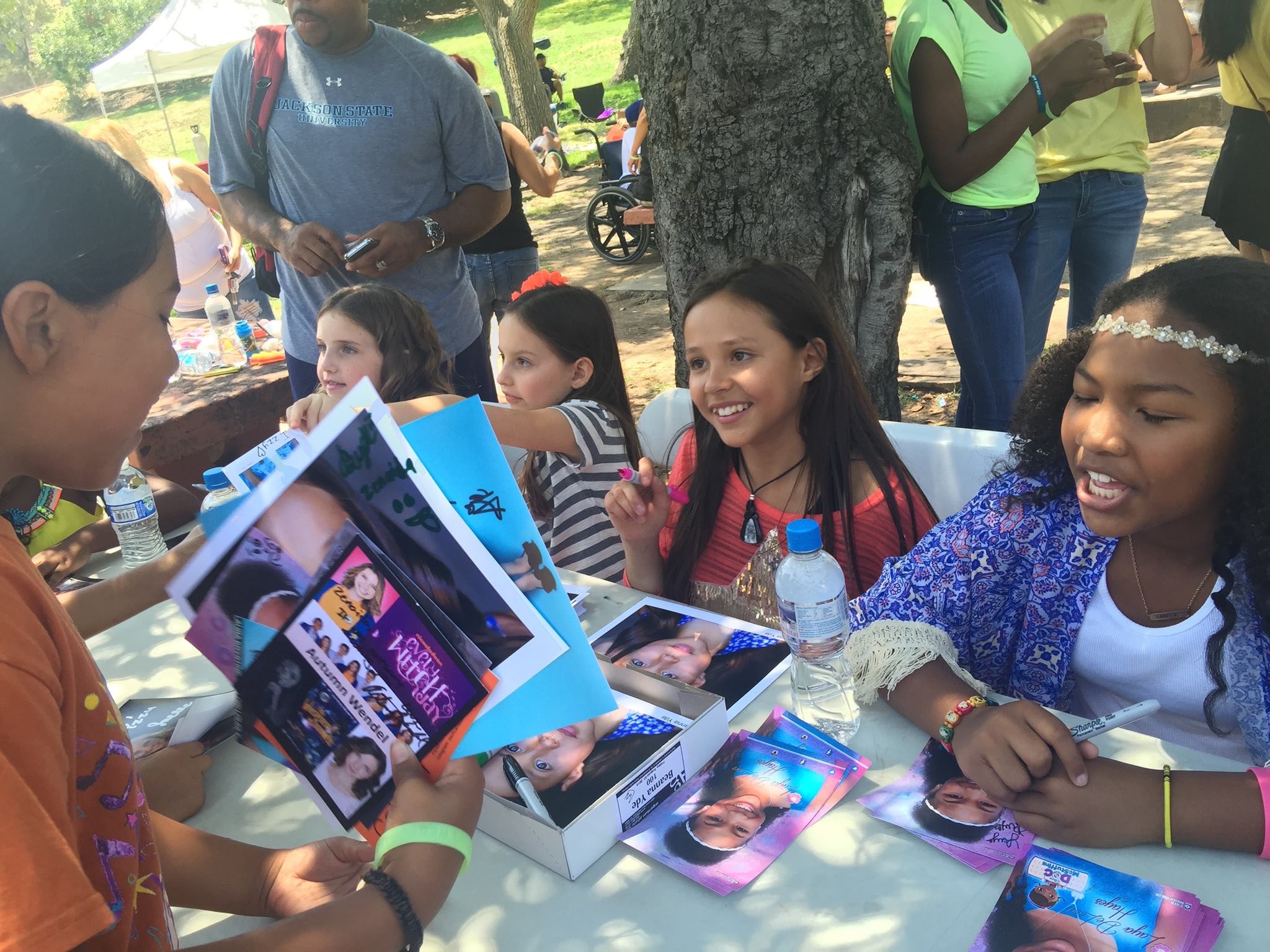 Shea having a blast signing autographs at the 2015 Walk for Kids Growth red carpet and celeb meet and great. Shea sitting next to Bryanna Yde, and Laya Hayes and Joelle Better.