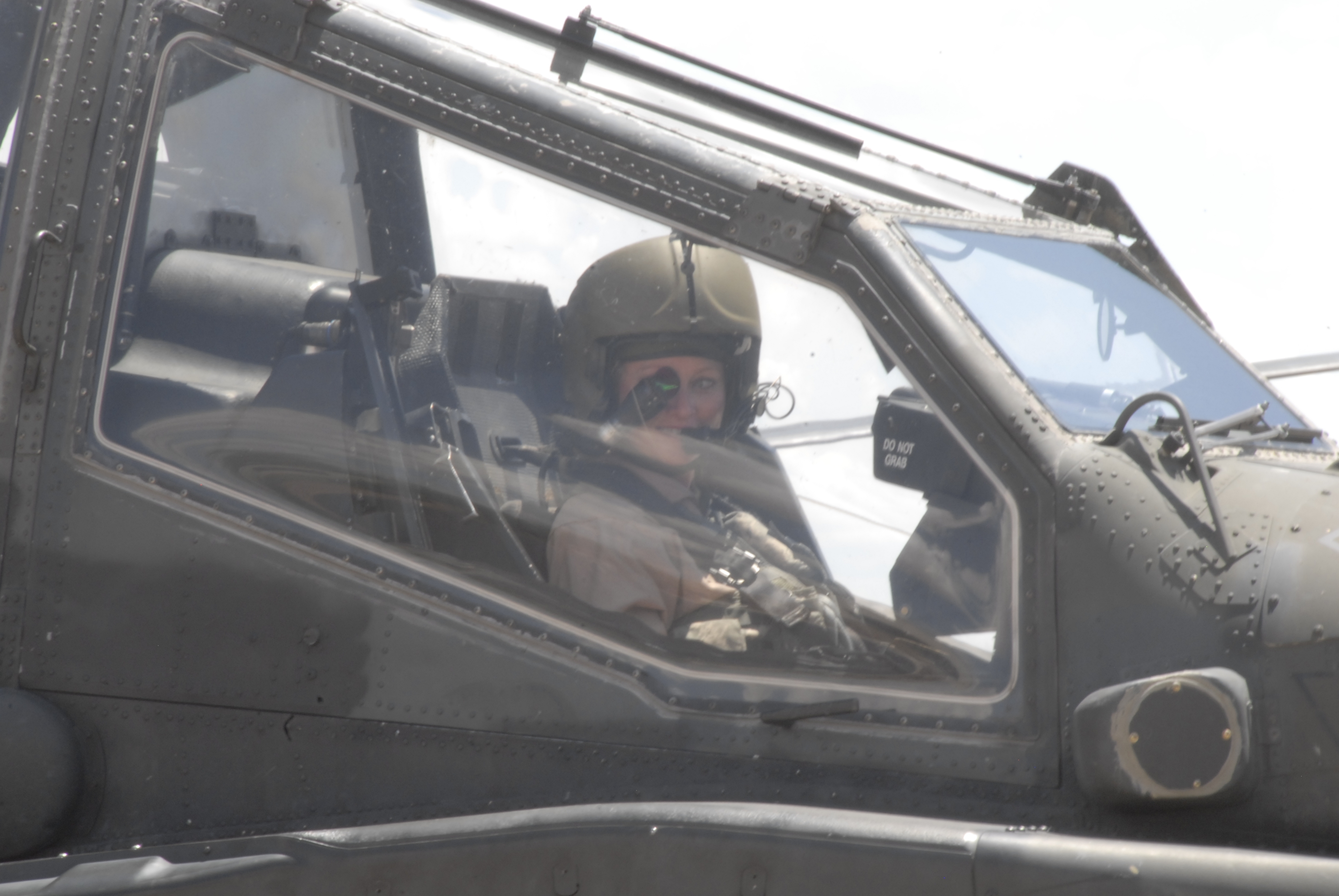 War Reporter Alex Quade rides along in the front seat of an Apache helicopter, with helmet and targeting monocle, to learn about 