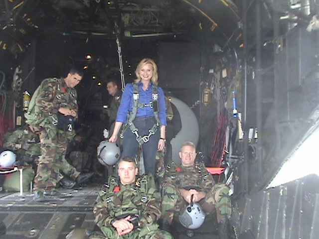 War Reporter Alex Quade with elite Air Force Spec Ops PJs in back of cargo plane, about to parachute out. Quade's special 