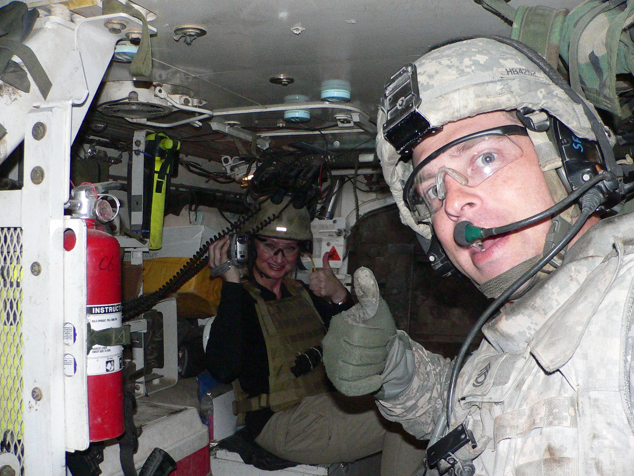 War Reporter Alex Quade inside Stryker vehicle on patrol with Cavalry unit. Iraq, 2008.