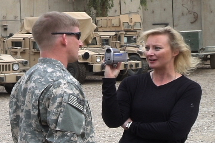 War Reporter Alex Quade interviewing Special Forces soldier in secret compound location, near Baghdad, Iraq, 2008.