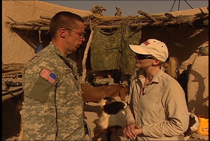 CNN Correspondent Alex Quade in makeshift compound with U.S. Army, and goats. Here Quade interviews an Air Force JTAC, who calls in the airstrikes to protect them,while on air assault with Task Force Fury in Helmand Province, Afghanistan, 2007.