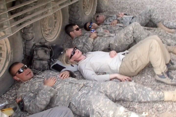 War Reporter Alex Quade catches a rest between combat missions with US Army in Iraq. Quade uses body armor as pillow. 2007.