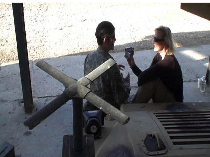 War Reporter Alex Quade interviewing Green Beret in Iraq. 2008.