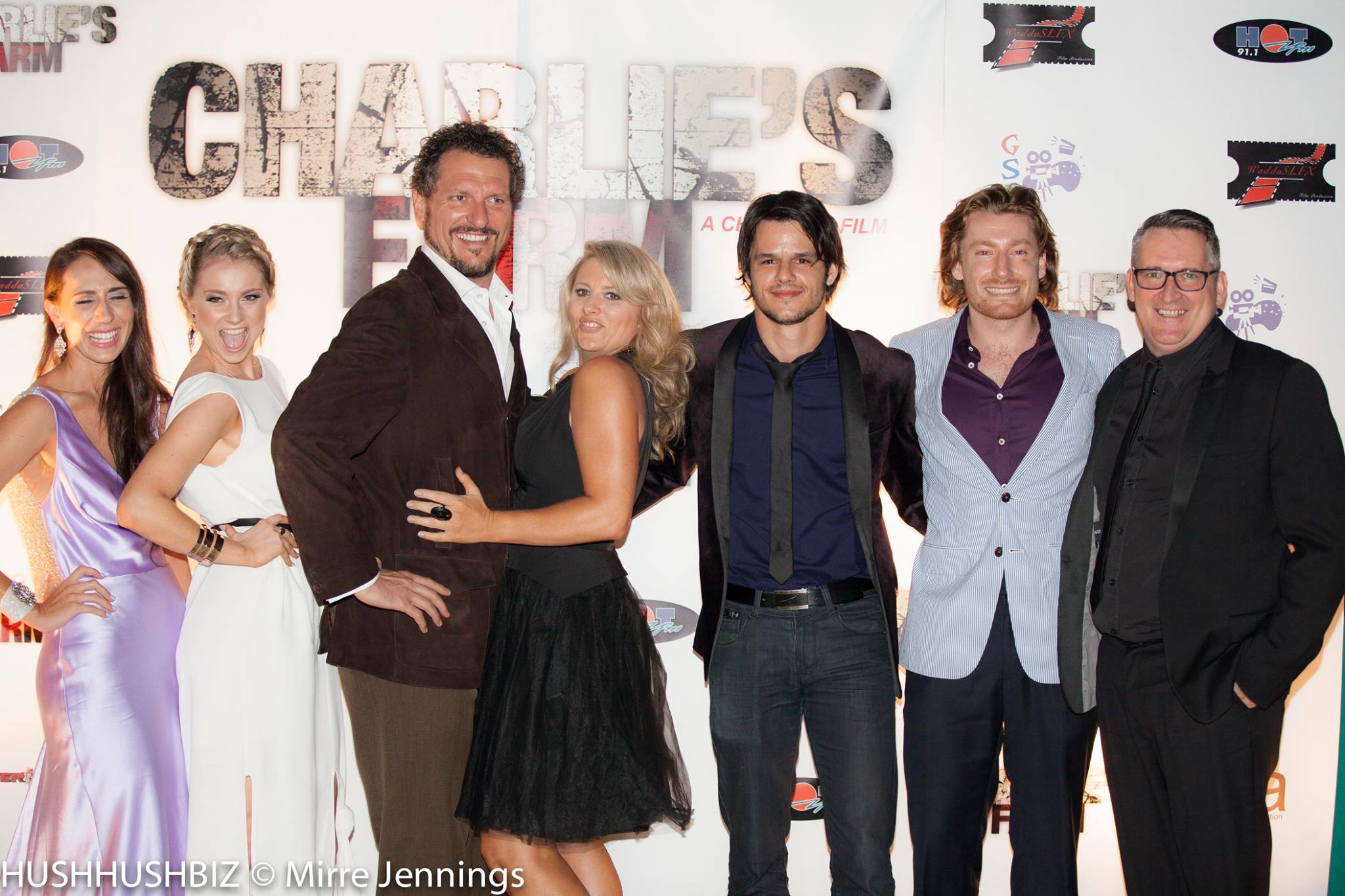 Photo shoots on the Charlie's Farm World Premiere red carpet with the other supporting cast members