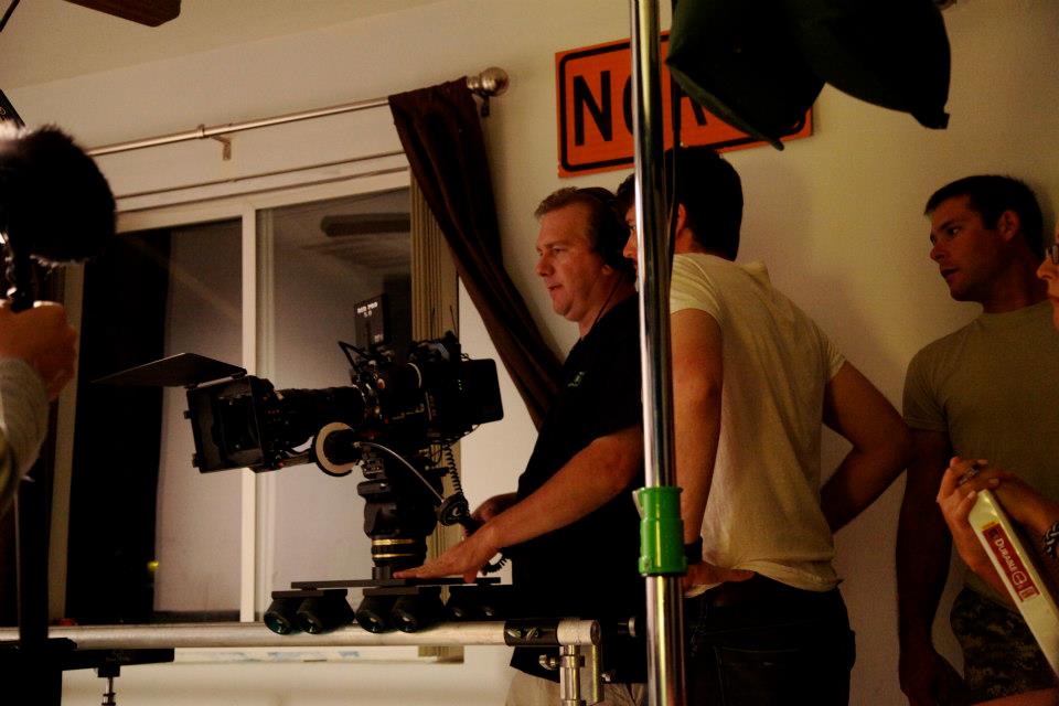 Jason Wiechert (right) with Jonathan Millard (center) and Curt Pair watching playback while filming a scene in 