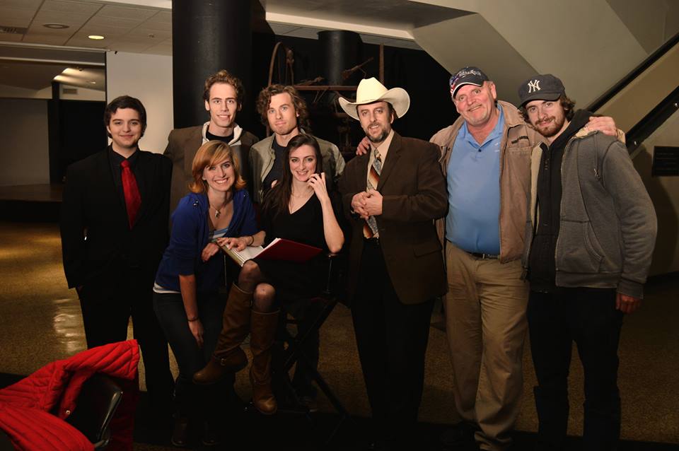 On the set of Romans XIII. Left to right, back row: Samuel Thrasher, Nathan Jacobson, Kaiser Johnson, Ted M.W. Rich, Bryant Grizzell, and Matthew Perdie. Left to right, front row: Leona Worcester and Amanda Read.