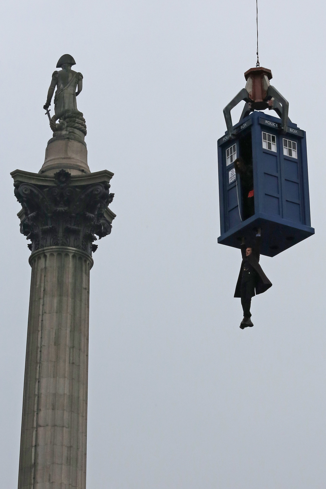 Matt Smith hangs from a suspended Tardis during filming of Dr Who, in Trafalgar Square on April 9, 2013 in London, England.