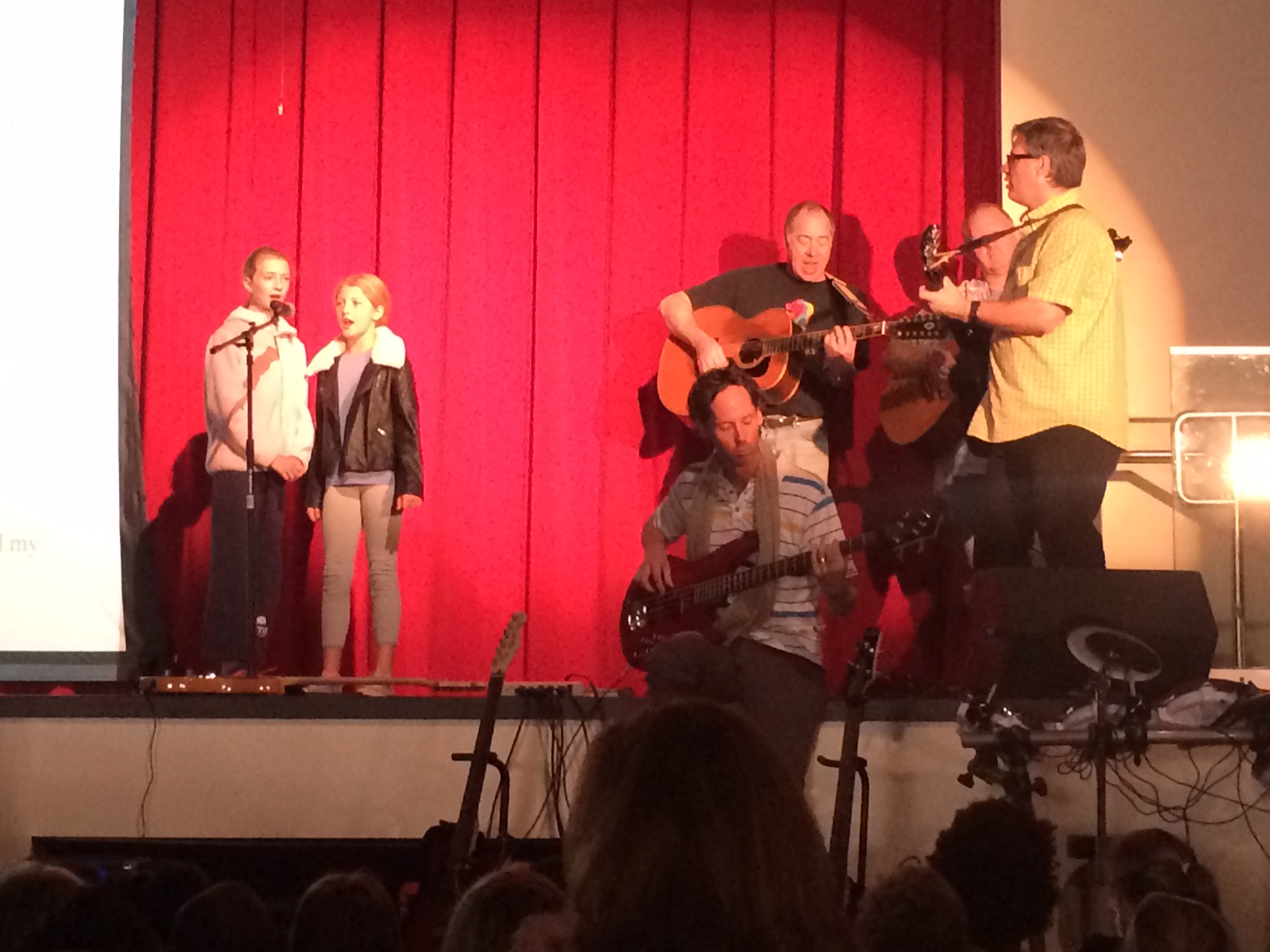 Singing a song for the entire WNS student body, Ryan and Hannah rehearse for a school-wide community event (Age 10, Nov. 2014). Their performance of 