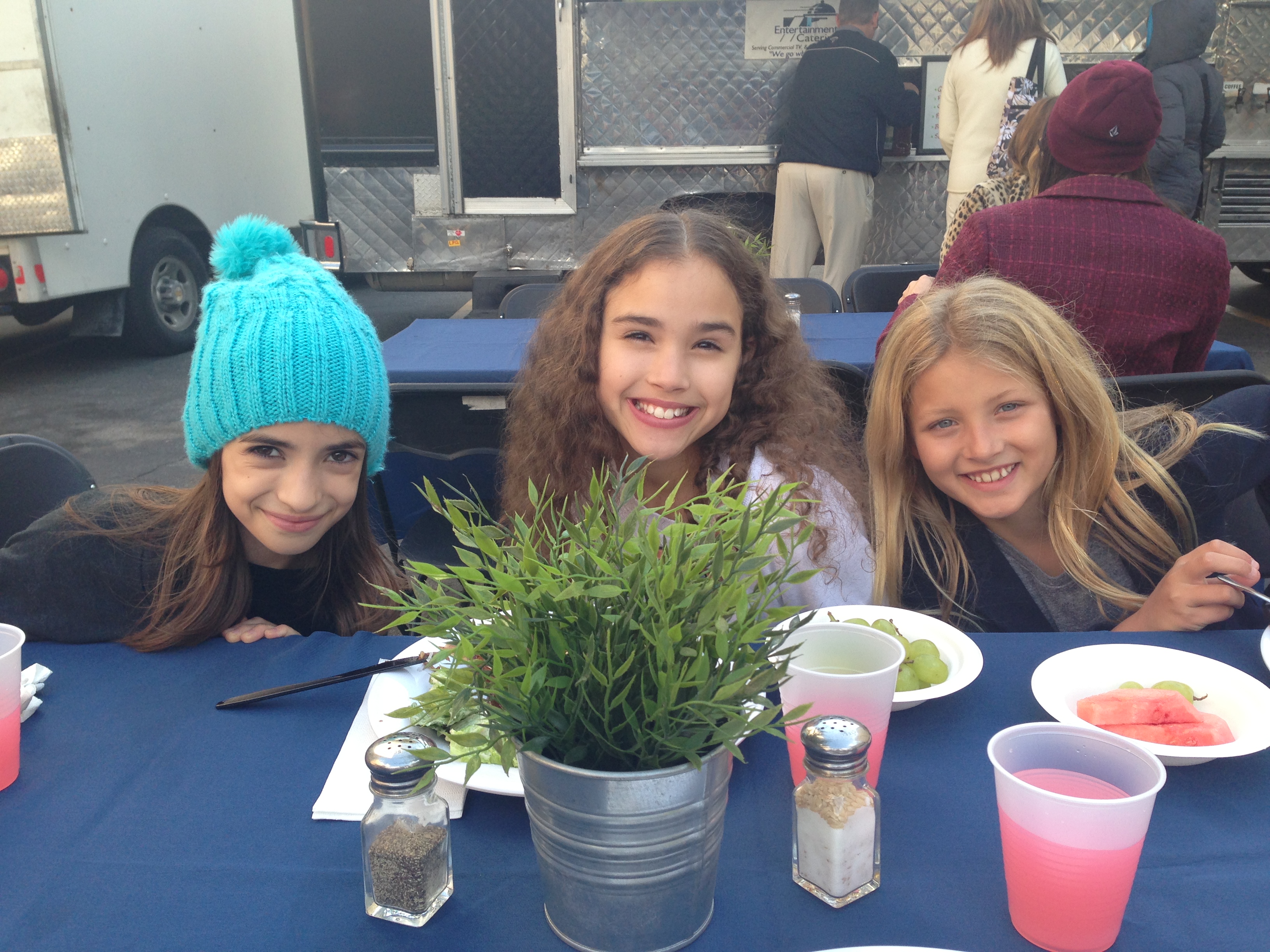 Actresses (L to R) Soni Bringas, Gracie Haschak, and Ryan Baumann break for lunch while starring in the AMERICAN GIRL - Isabelle, Girl of the Year 2014 doll commercial (Dec. 2013).