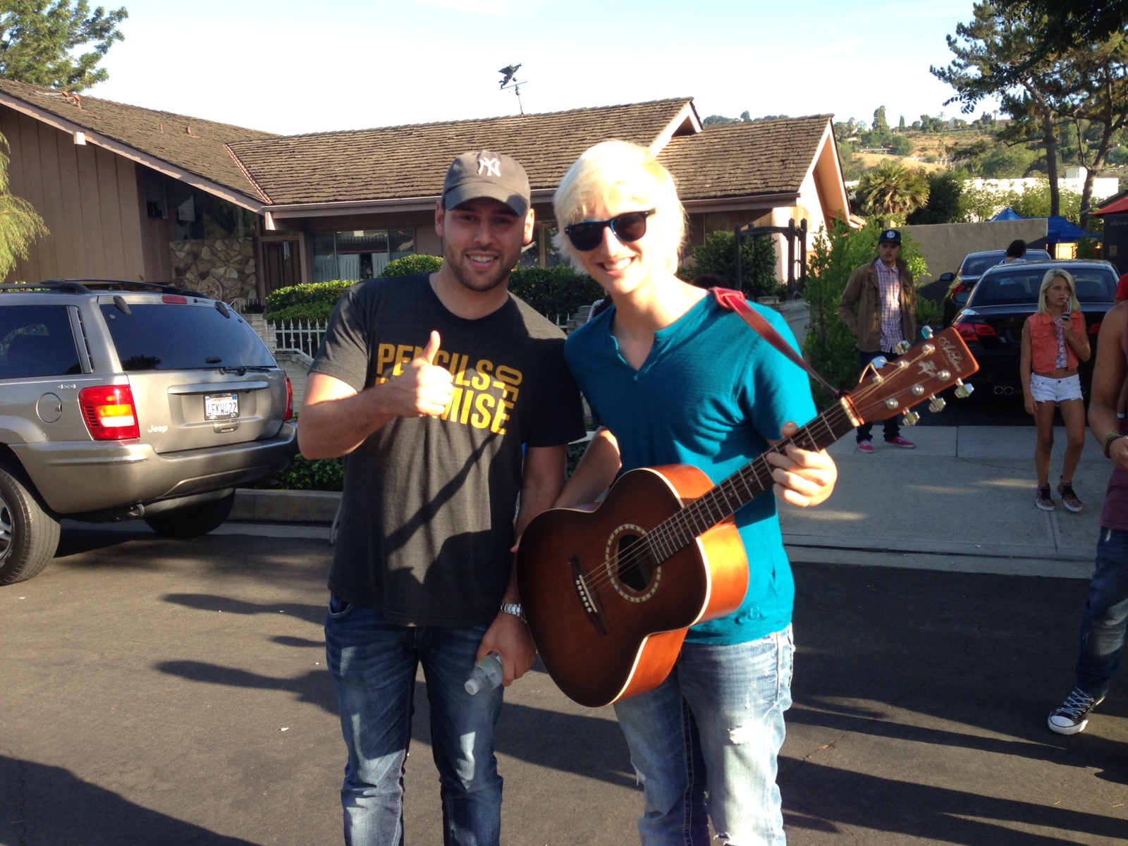 Dylan Sawler and Scooter Braun on set