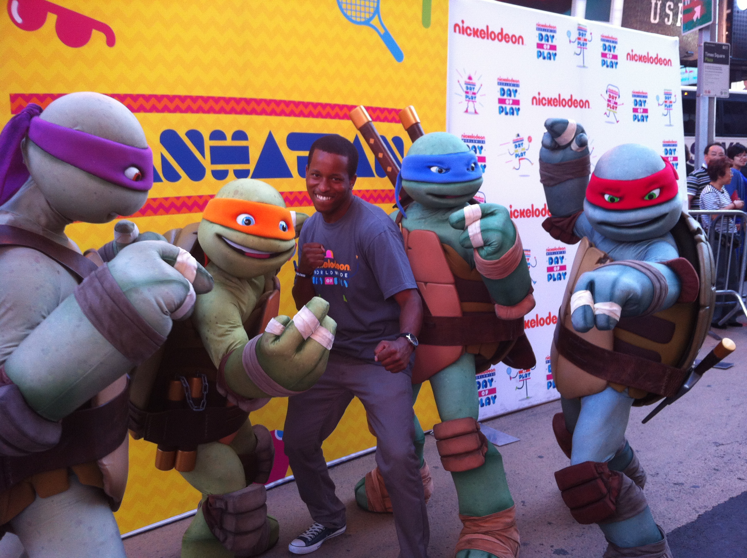 John Maurice Harris posing with the Ninja Turtles during Nickelodeon's 