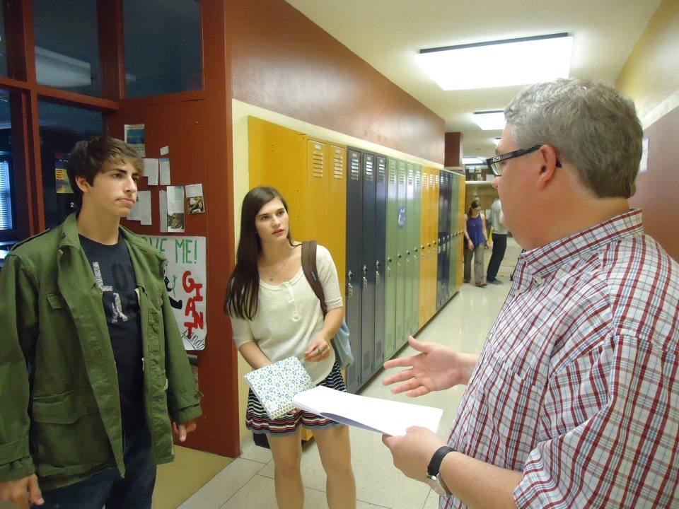 Receiving notes from writer Kevin Dilmore with Mitchell McCroskey and Andrea Fantauzzi while onset for Make Up Work.