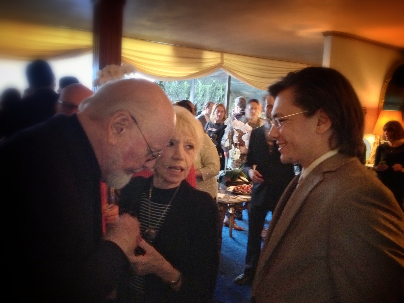 Charles-Henri Avelange with composer John Williams, gracefully accepting compliments on his 49 Oscar Nominations.
