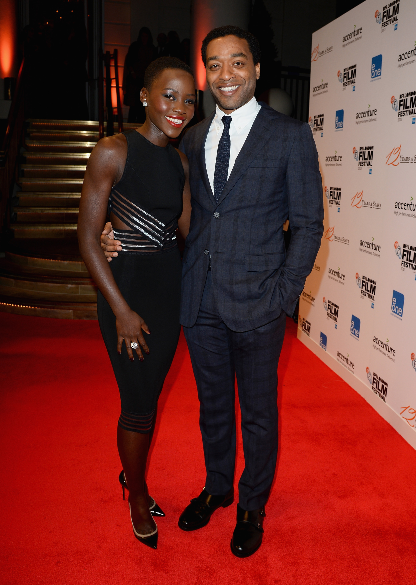 Chiwetel Ejiofor and Lupita Nyong'o at event of 12 vergoves metu (2013)