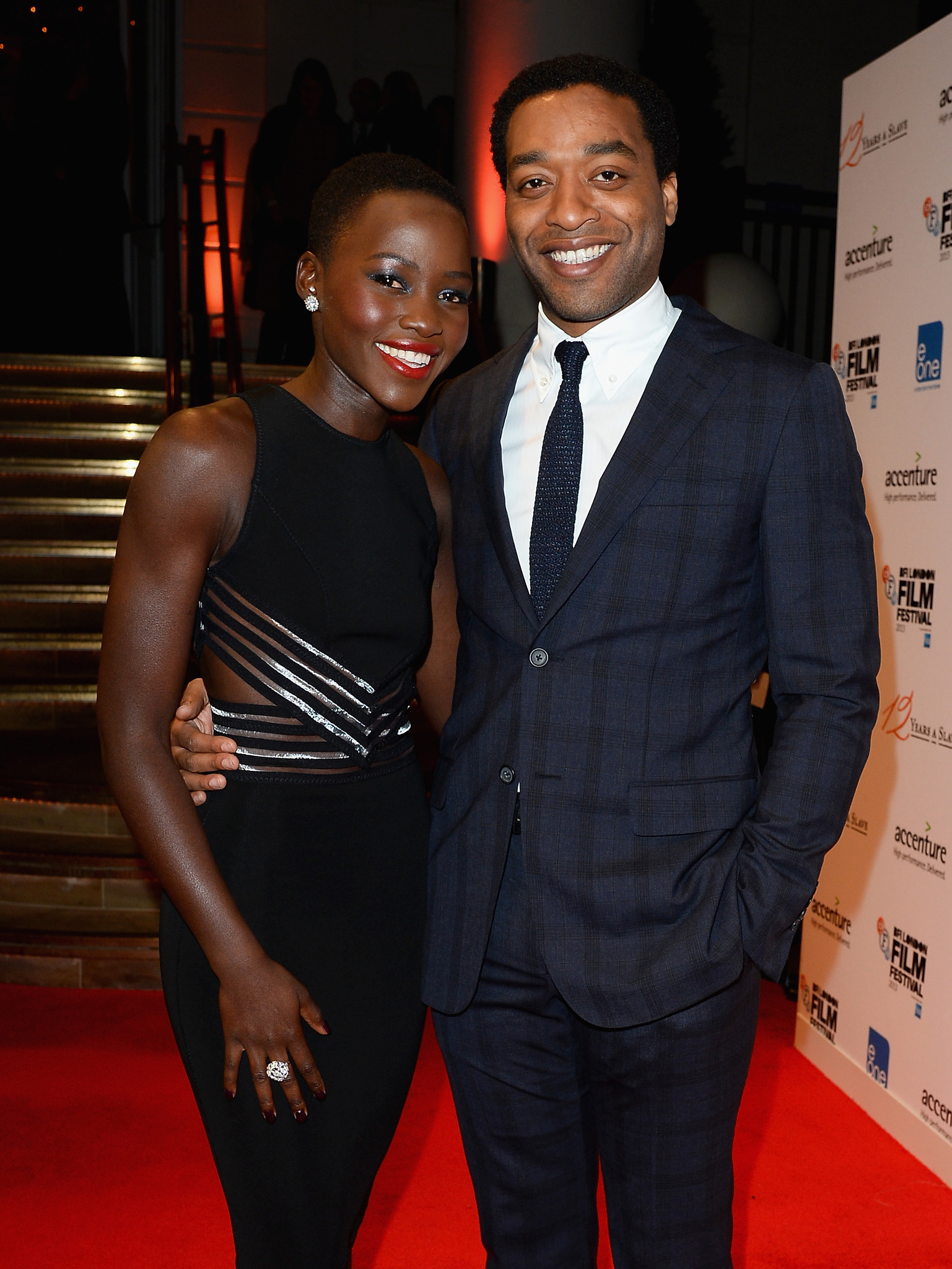 Chiwetel Ejiofor and Lupita Nyong'o at event of 12 vergoves metu (2013)