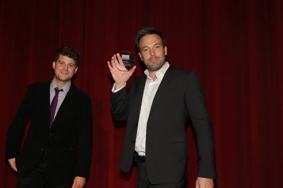 Ryan Moody presenting Ben Affleck with the Filmmaker of the Year award at the 2013 UCLA Film Festival.