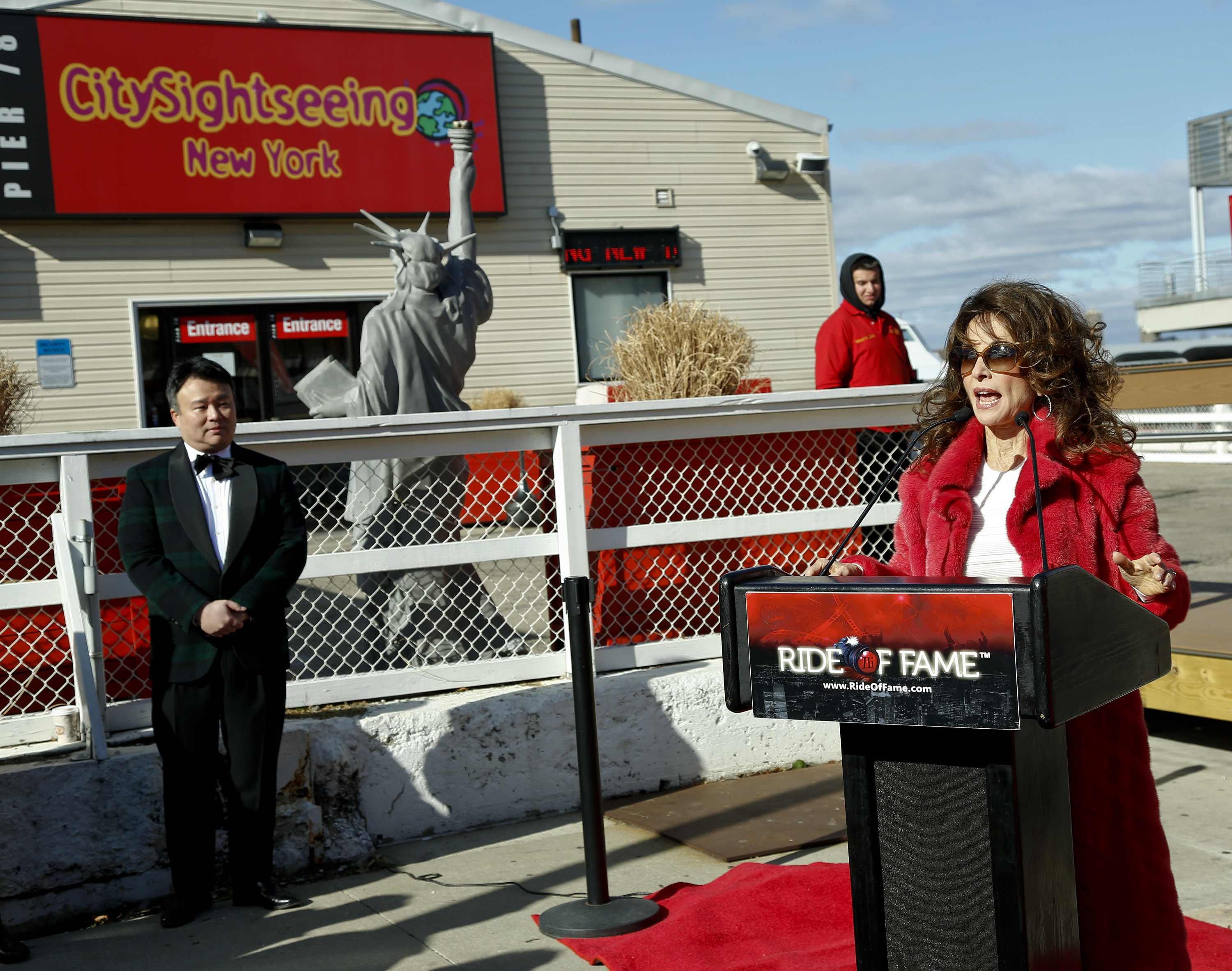 Susan Lucci addresses the press at her Ride of Fame ceremony, with David W. Chien (November 19th, 2013)