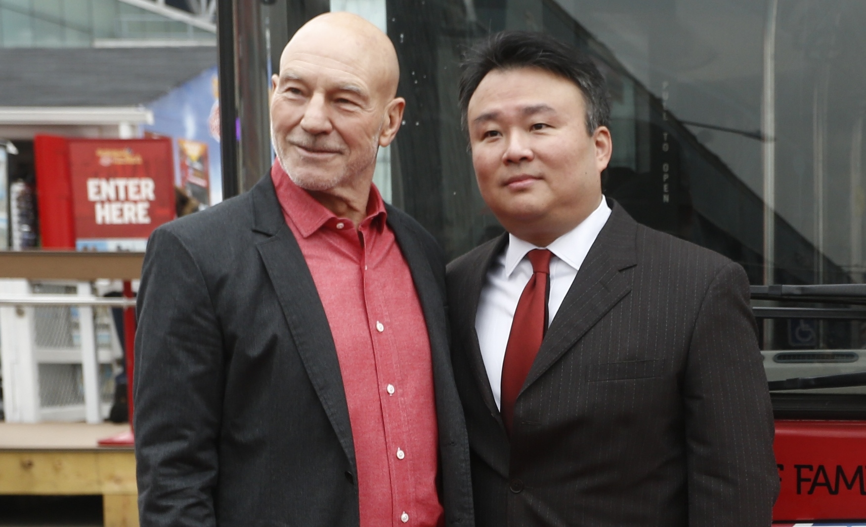 David W. Chien poses with Sir Patrick Stewart at Ride of Fame (December 4th, 2013).